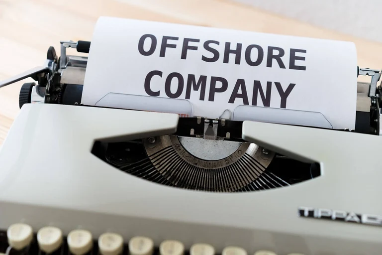 Text in a typewriter that says offshore company