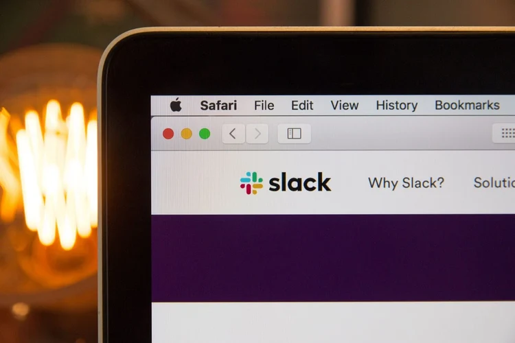 A close-up of a computer monitor displaying Slack, an online application created by a SaaS development company.