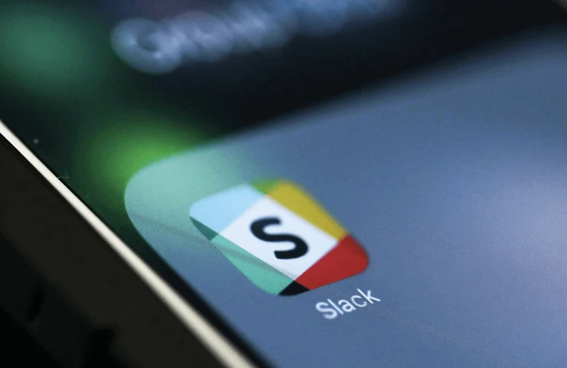 A close-up view of the Slack icon on a phone screen. 