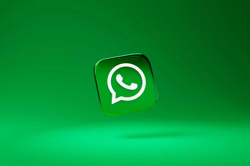 A floating WhatsApp icon on a green background
