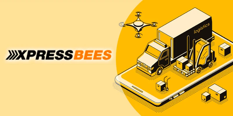 An illustration from Xpressbees's website in black and yellow with trucks and boxes featured. 